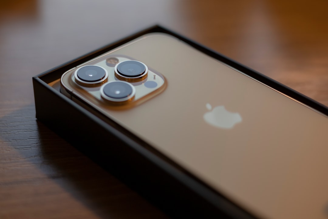 Close-up of the iPhone 17 Pro Max in a sleek titanium finish, showcasing its triple-camera system and large OLED display, set against a modern tech background.